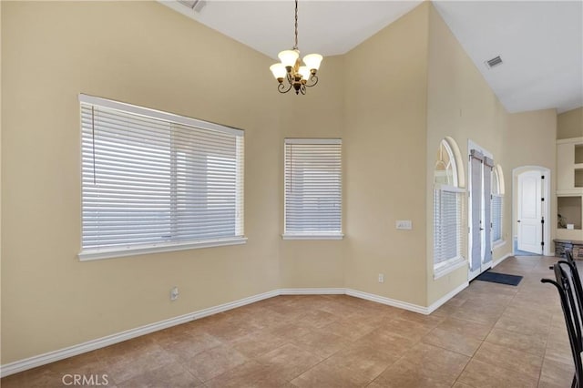 21777 Poppy Rd, Apple Valley, CA 92308 - empty room with a chandelier, a high ceiling, and light tile patterned flooring