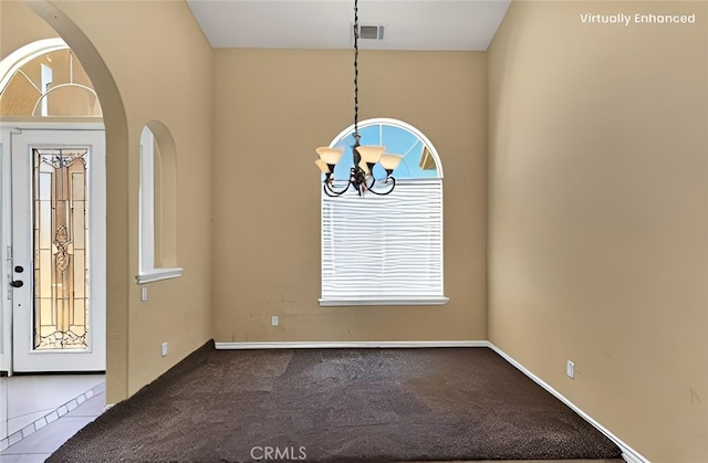 21777 Poppy Rd, Apple Valley, CA 92308 - foyer featuring a chandelier, plenty of natural light, and carpet floors