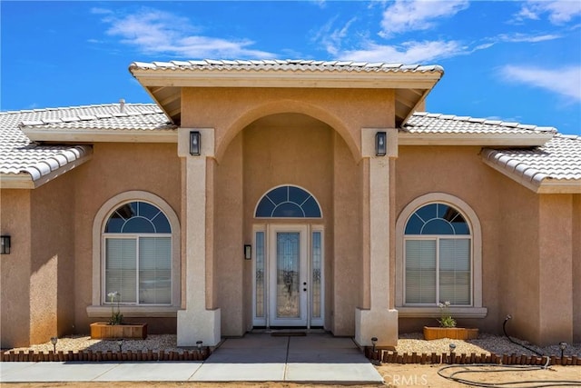 21777 Poppy Rd, Apple Valley, CA 92308 - property entrance with a tiled roof and stucco siding