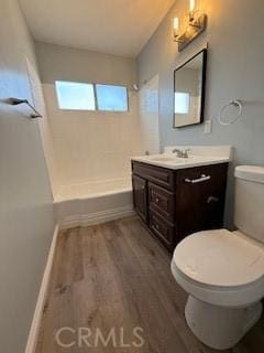 8129 Milna Ave, Whittier, CA 90606 - bathroom featuring vanity, wood finished floors, and shower / bathtub combination