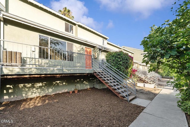 248 E Washington Blvd Unit 4, Pasadena, CA 91104 - rear view of property with stairway and stucco siding