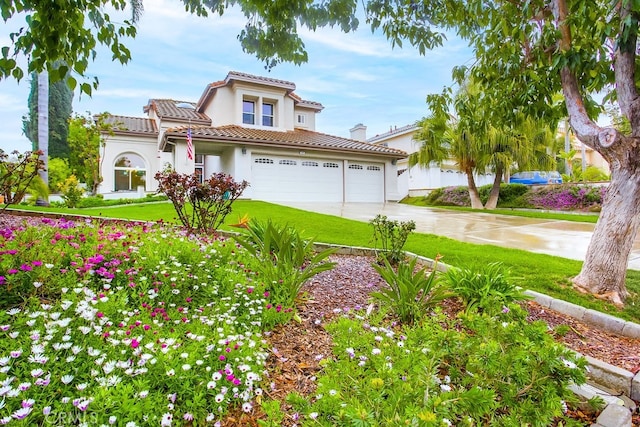 737 Corona Dr, Oceanside, CA 92057 - mediterranean / spanish house with concrete driveway, a tile roof, stucco siding, a garage, and a front lawn