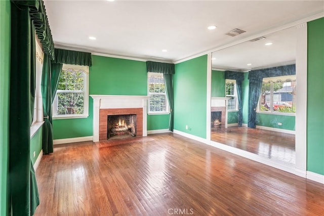 2322 W 156th St, Gardena, CA 90249 - unfurnished living room with a fireplace with flush hearth, ornamental molding, plenty of natural light, and wood finished floors