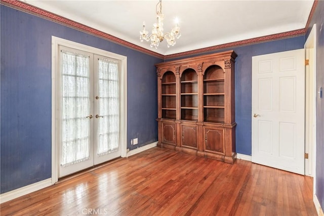2322 W 156th St, Gardena, CA 90249 - unfurnished dining area with french doors, hardwood / wood-style floors, a chandelier, and crown molding