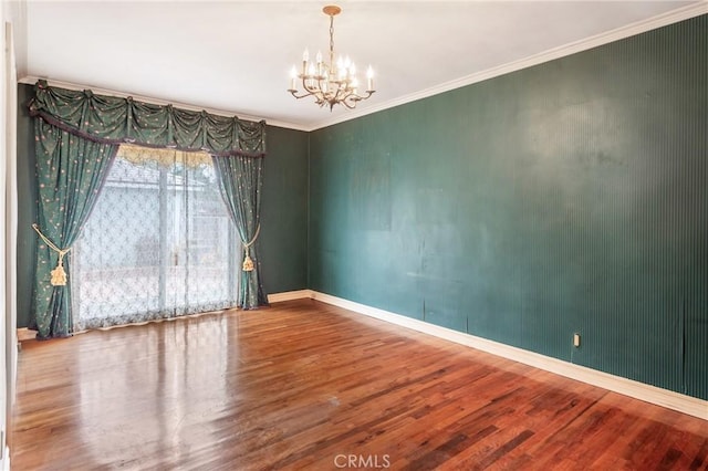 2322 W 156th St, Gardena, CA 90249 - empty room featuring wood finished floors, a chandelier, and ornamental molding