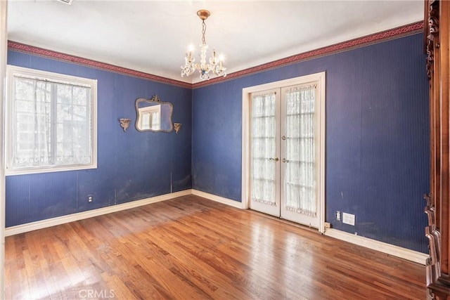 2322 W 156th St, Gardena, CA 90249 - unfurnished room featuring french doors, a chandelier, and wood finished floors