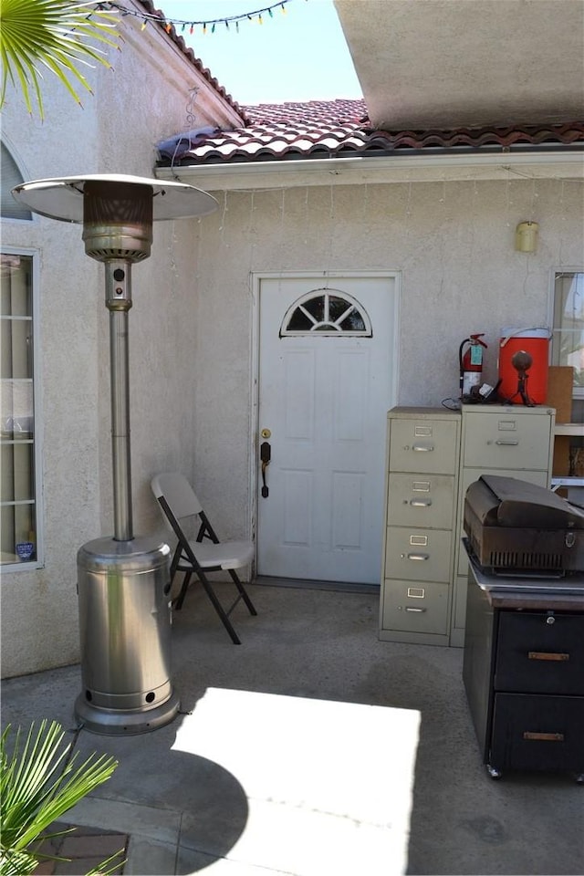 31811 Whispering Palms Trl, Cathedral City, CA 92234 - view of exterior entry featuring stucco siding and a tiled roof
