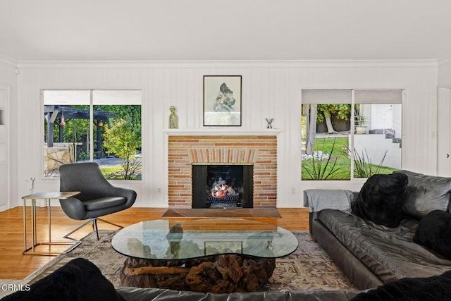 1620 Knollwood Dr, Pasadena, CA 91103 - living room featuring ornamental molding, healthy amount of natural light, wood finished floors, and a fireplace