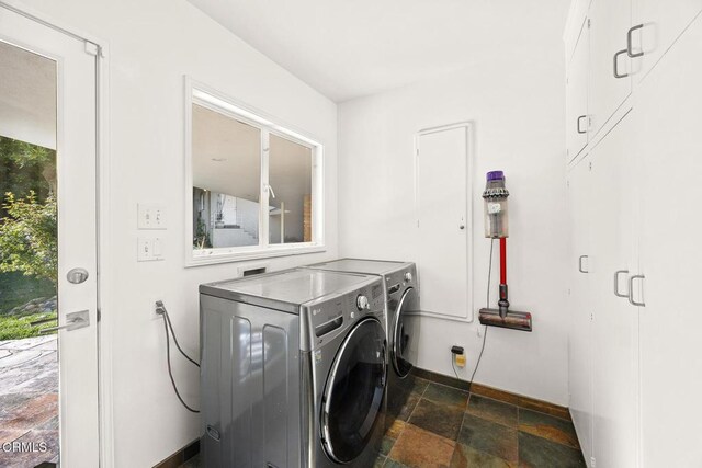 1620 Knollwood Dr, Pasadena, CA 91103 - laundry area with washing machine and dryer and dark stone finish floors
