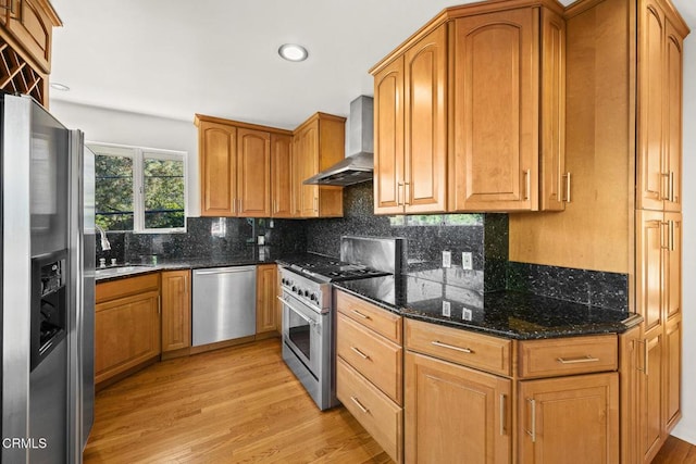 1620 Knollwood Dr, Pasadena, CA 91103 - kitchen featuring appliances with stainless steel finishes, wall chimney exhaust hood, light wood-type flooring, backsplash, and dark stone countertops