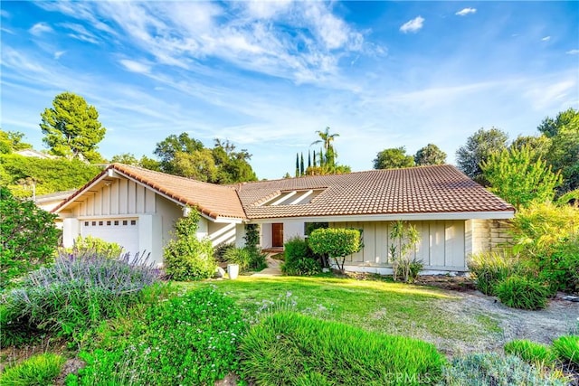 3811 Algonaut Dr, Calabasas, CA 91302 - single story home featuring board and batten siding, a tile roof, and a garage