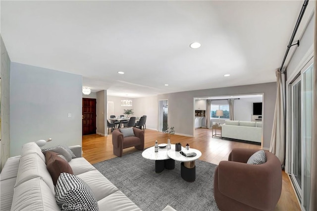 3811 Algonaut Dr, Calabasas, CA 91302 - living area with wood finished floors, recessed lighting, and a chandelier