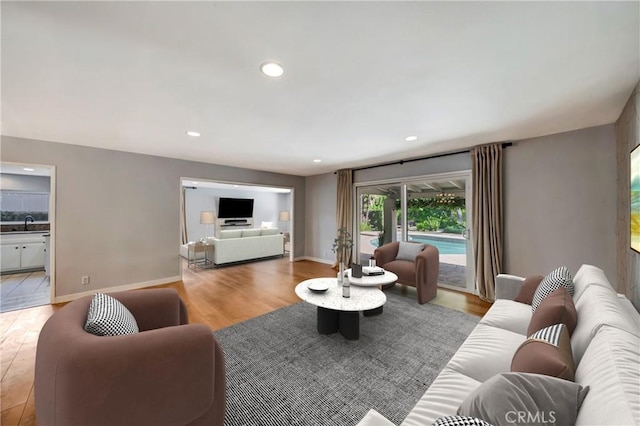 3811 Algonaut Dr, Calabasas, CA 91302 - living room featuring light wood-style floors and recessed lighting