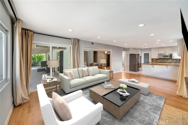 3811 Algonaut Dr, Calabasas, CA 91302 - living area with light wood-style floors and recessed lighting