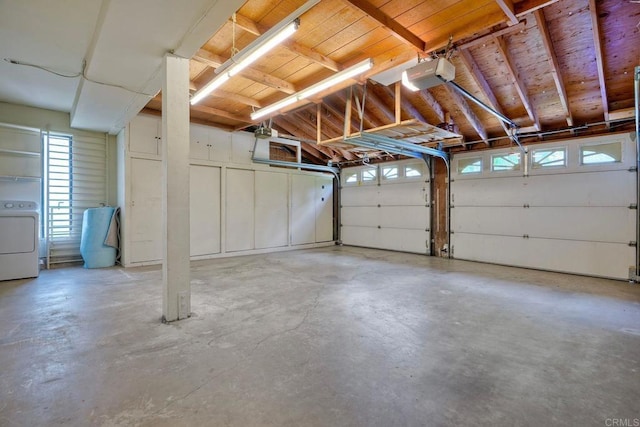 2315 Nicklaus Dr, Oceanside, CA 92056 - garage featuring washer / clothes dryer and a garage door opener