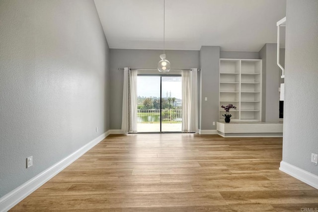 2315 Nicklaus Dr, Oceanside, CA 92056 - unfurnished dining area with light wood-style floors and a textured wall