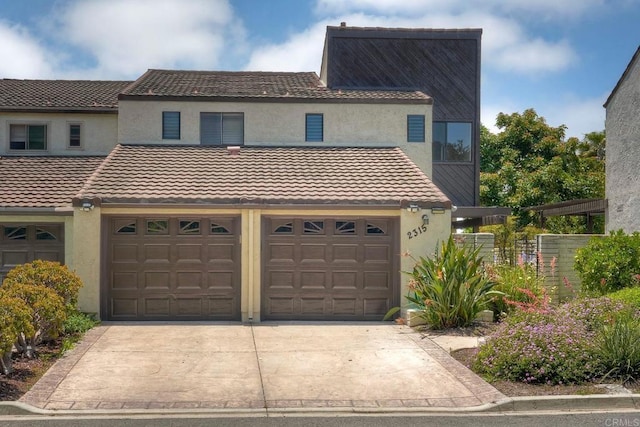 2315 Nicklaus Dr, Oceanside, CA 92056 - multi unit property featuring stucco siding, driveway, a tile roof, and a garage