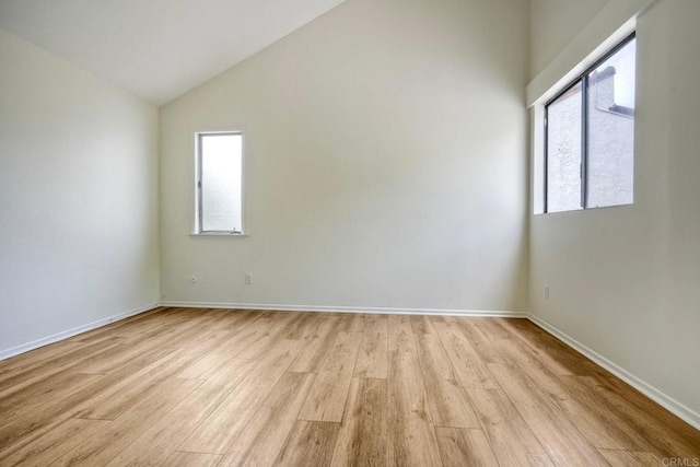 2315 Nicklaus Dr, Oceanside, CA 92056 - unfurnished room featuring light wood-style flooring, plenty of natural light, and vaulted ceiling