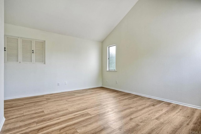 2315 Nicklaus Dr, Oceanside, CA 92056 - unfurnished room with light wood finished floors and high vaulted ceiling