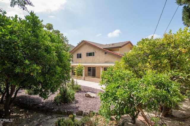 191 Haborview Ct, Ventura, CA 93003 - view of side of home with a tile roof, a patio area, and stucco siding