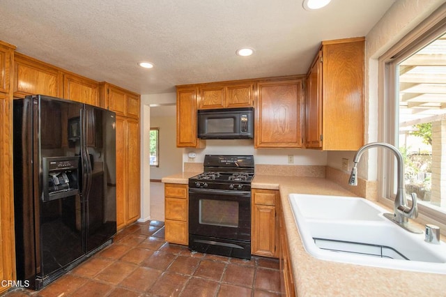191 Haborview Ct, Ventura, CA 93003 - kitchen with black appliances, light countertops, recessed lighting, and brown cabinets