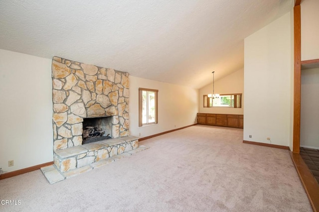 191 Haborview Ct, Ventura, CA 93003 - unfurnished living room with carpet flooring, vaulted ceiling, a chandelier, a fireplace, and a textured ceiling
