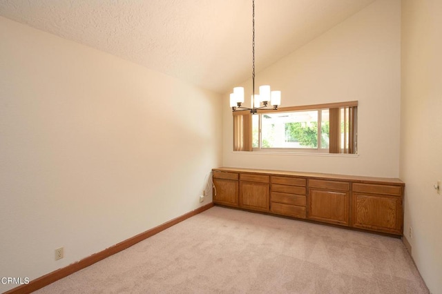 191 Haborview Ct, Ventura, CA 93003 - empty room featuring light colored carpet, a chandelier, and vaulted ceiling