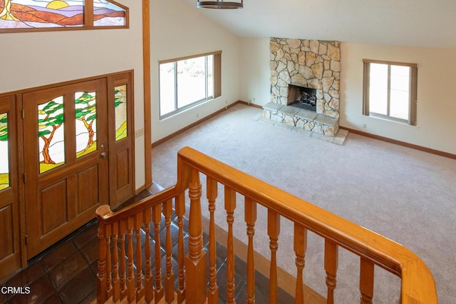 191 Haborview Ct, Ventura, CA 93003 - foyer with plenty of natural light, carpet, a fireplace, stairs, and high vaulted ceiling
