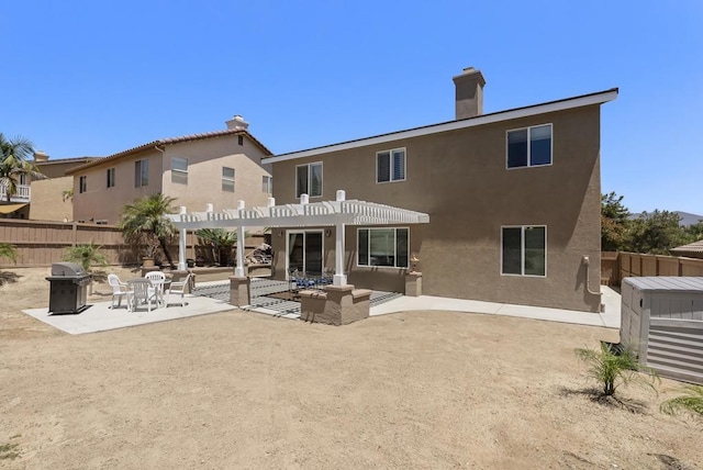 1222 N Creekside Dr, Chula Vista, CA 91915 - back of house featuring a pergola, stucco siding, a patio area, and a chimney