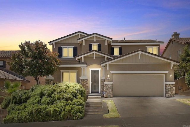1222 N Creekside Dr, Chula Vista, CA 91915 - craftsman-style home featuring an attached garage, concrete driveway, stone siding, and stucco siding