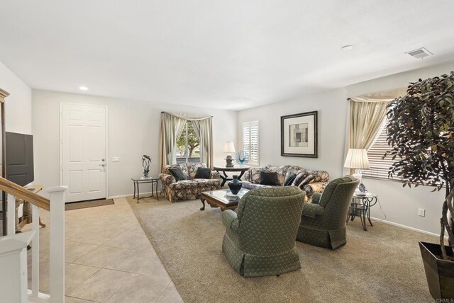 1222 N Creekside Dr, Chula Vista, CA 91915 - living area featuring light tile patterned flooring, light colored carpet, and recessed lighting
