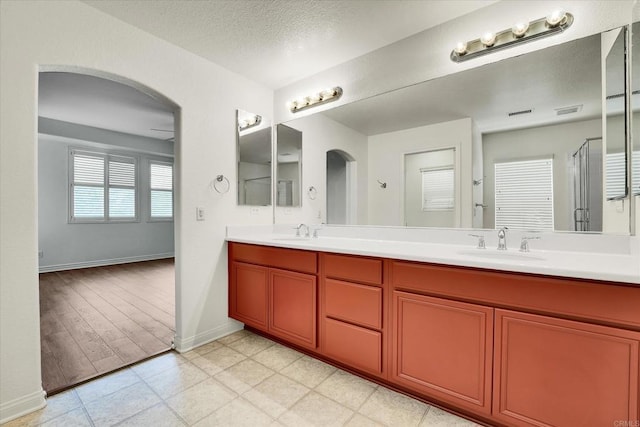 1679 Kincaid Ave, Chula Vista, CA 91913 - full bath featuring double vanity, a shower stall, and a textured ceiling