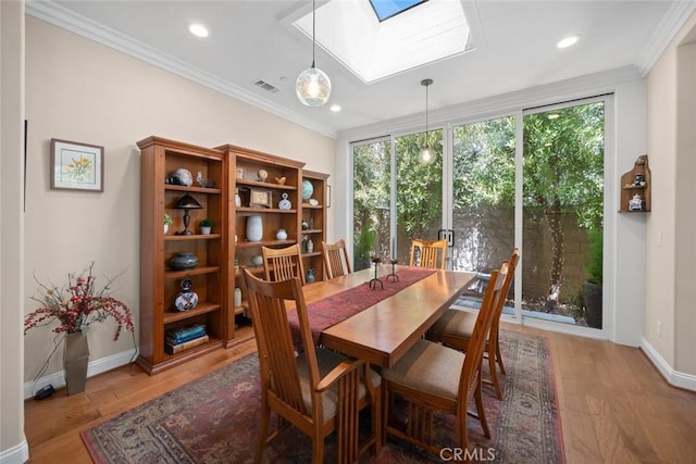 1432 Vicki Ln, Nipomo, CA 93444 - dining room featuring a skylight, ornamental molding, light wood-style floors, and recessed lighting