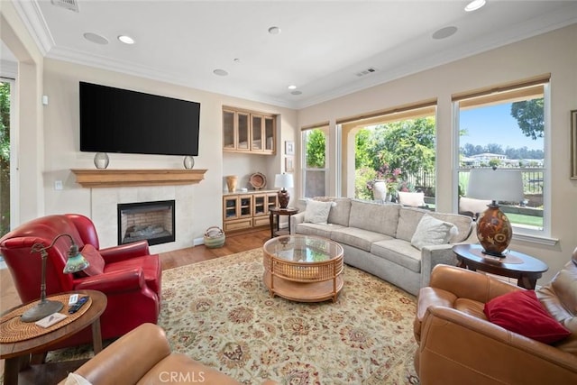 1432 Vicki Ln, Nipomo, CA 93444 - living room featuring plenty of natural light, crown molding, wood finished floors, a tile fireplace, and recessed lighting