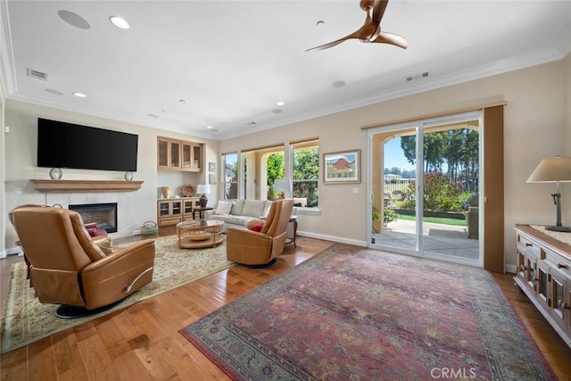 1432 Vicki Ln, Nipomo, CA 93444 - living room featuring ornamental molding, wood finished floors, a ceiling fan, a tile fireplace, and recessed lighting