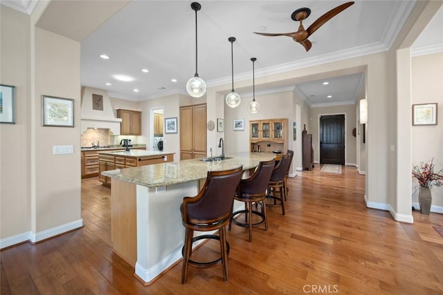 1432 Vicki Ln, Nipomo, CA 93444 - kitchen featuring premium range hood, a center island, wood-type flooring, recessed lighting, and a breakfast bar area