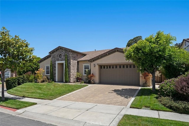 1432 Vicki Ln, Nipomo, CA 93444 - view of front facade featuring an attached garage, stone siding, stucco siding, a front lawn, and driveway