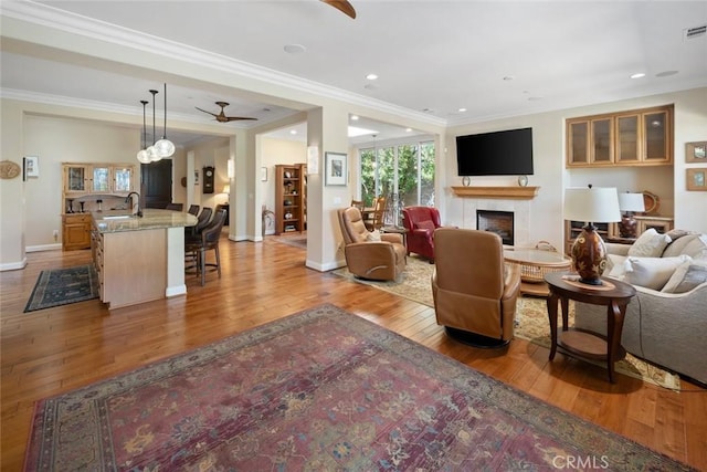 1432 Vicki Ln, Nipomo, CA 93444 - living room with hardwood / wood-style flooring, a fireplace, a ceiling fan, ornamental molding, and recessed lighting