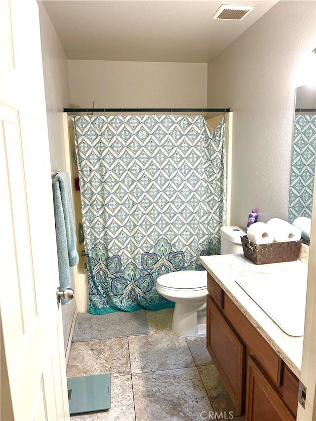245 Broadway St, Lake Elsinore, CA 92530 - full bathroom with vanity, a textured wall, stone finish flooring, and shower / bath combo