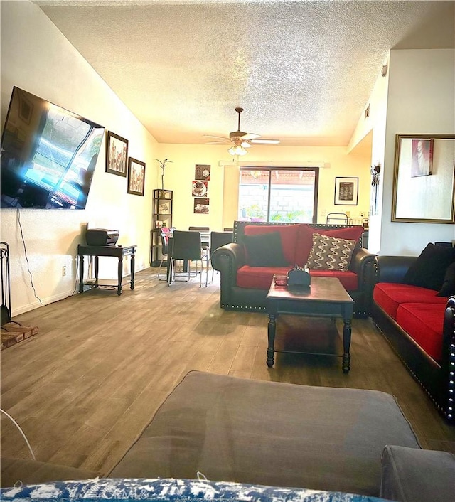 245 Broadway St, Lake Elsinore, CA 92530 - living room with lofted ceiling, a textured ceiling, wood finished floors, and ceiling fan