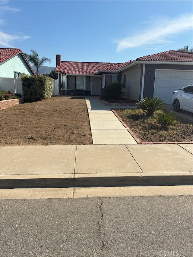 245 Broadway St, Lake Elsinore, CA 92530 - ranch-style house featuring a tile roof, a garage, and stucco siding