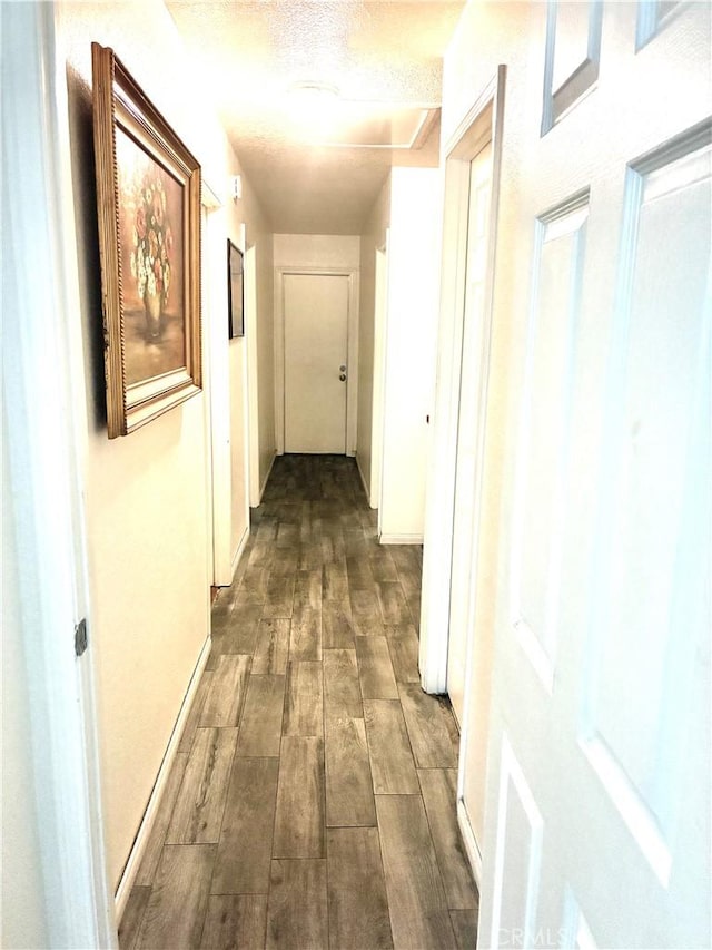 245 Broadway St, Lake Elsinore, CA 92530 - corridor featuring dark wood-style floors and a textured ceiling