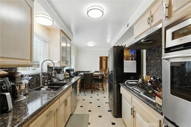 12516 Archwood St, North Hollywood, CA 91606 - kitchen featuring decorative backsplash, appliances with stainless steel finishes, crown molding, glass insert cabinets, and under cabinet range hood