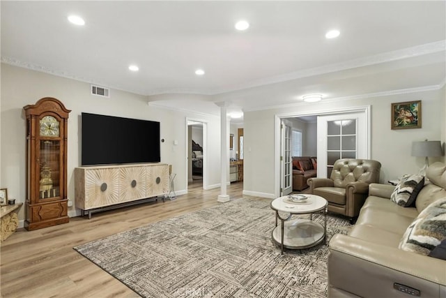 12516 Archwood St, North Hollywood, CA 91606 - living area featuring light wood finished floors, ornamental molding, recessed lighting, and ornate columns