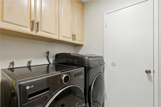 12516 Archwood St, North Hollywood, CA 91606 - laundry room featuring cabinet space and washing machine and dryer