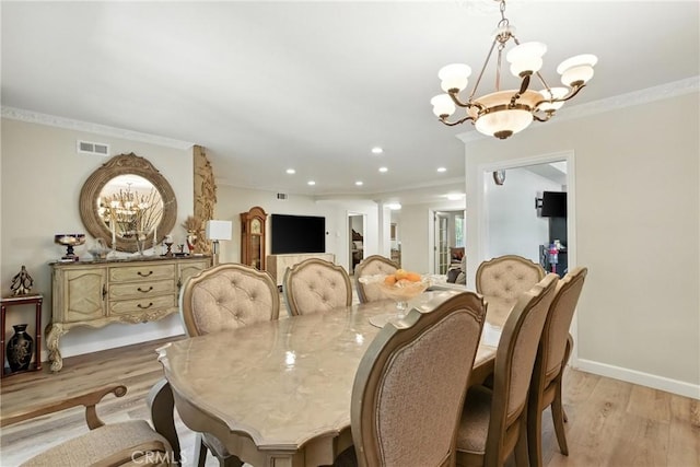 12516 Archwood St, North Hollywood, CA 91606 - dining room with a chandelier, light wood-style floors, recessed lighting, and crown molding
