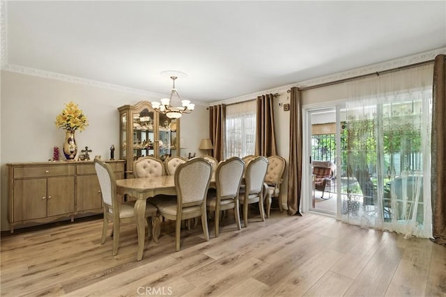 12516 Archwood St, North Hollywood, CA 91606 - dining room featuring a chandelier and light wood-type flooring