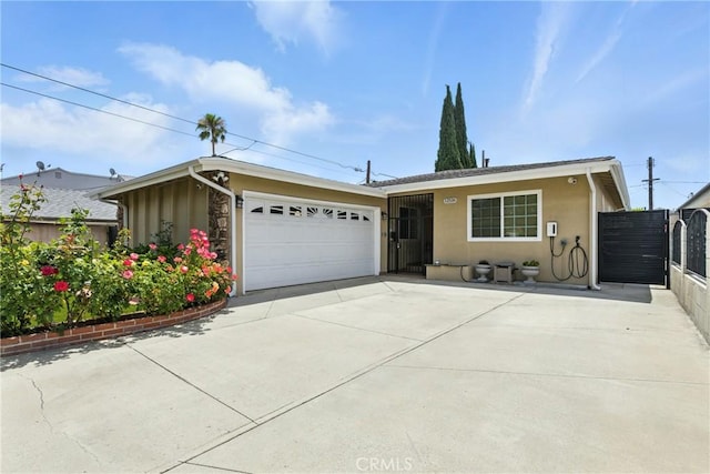 12516 Archwood St, North Hollywood, CA 91606 - view of front of property featuring stucco siding, a garage, and concrete driveway