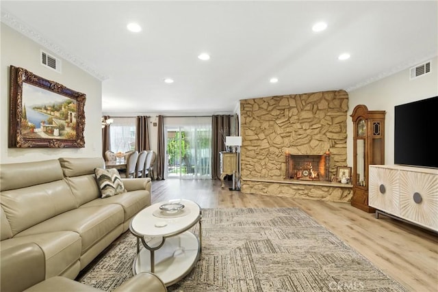 12516 Archwood St, North Hollywood, CA 91606 - living room featuring wood finished floors, recessed lighting, and a stone fireplace