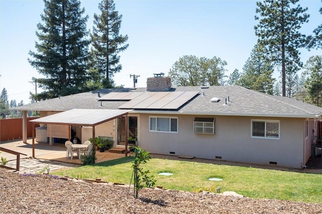 6354 Berkshire Ave, Paradise, CA 95969 - rear view of house with roof mounted solar panels, roof with shingles, a patio area, a chimney, and crawl space